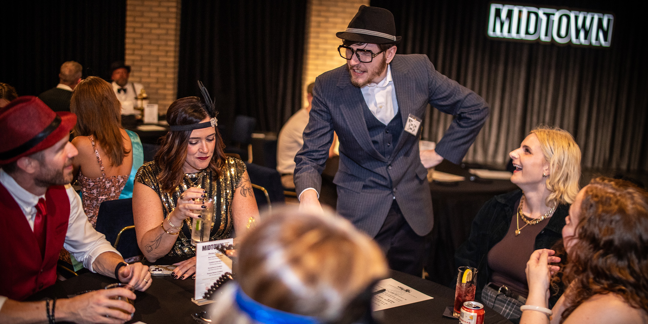 Guests at a Murder Mystery Company public dinner show in Sacramento
